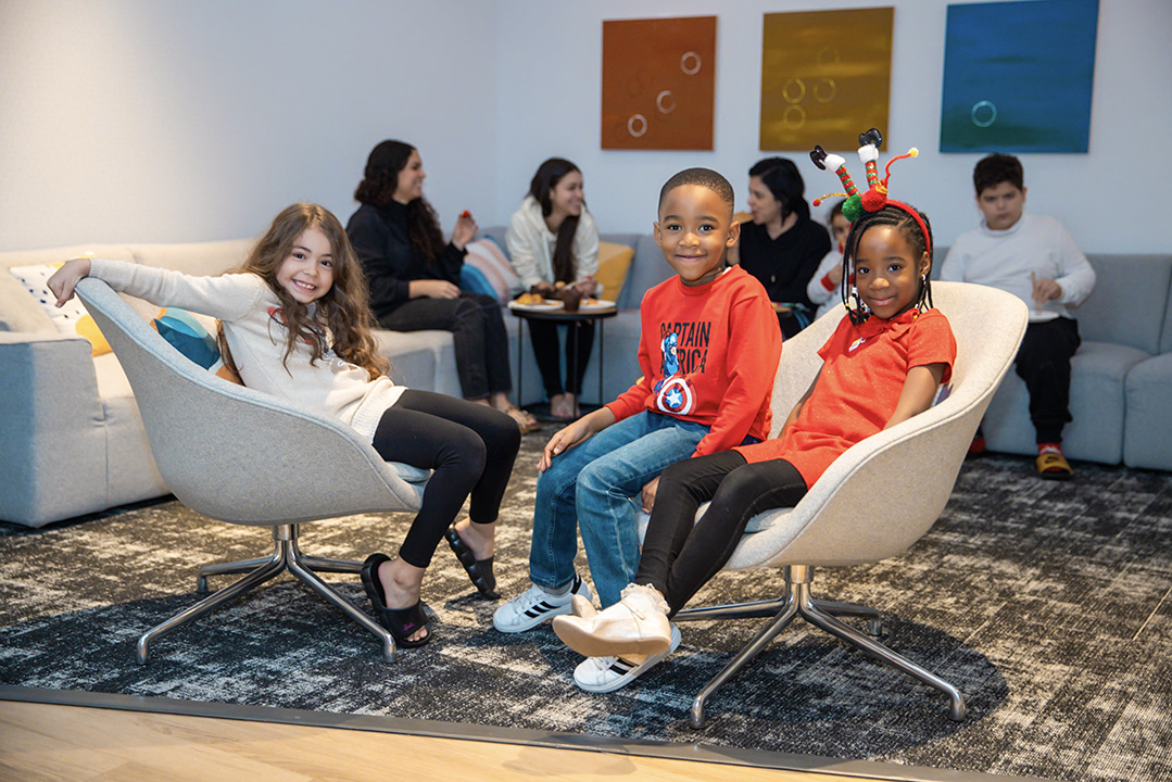 Children sitting on chairs